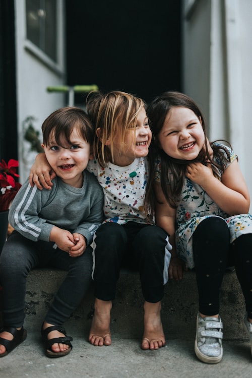 Siblings laughing together
