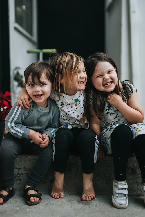 Siblings laughing together